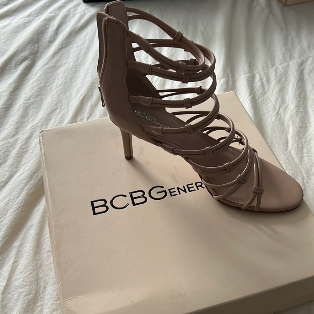Strappy high heeled open toe sandals.
